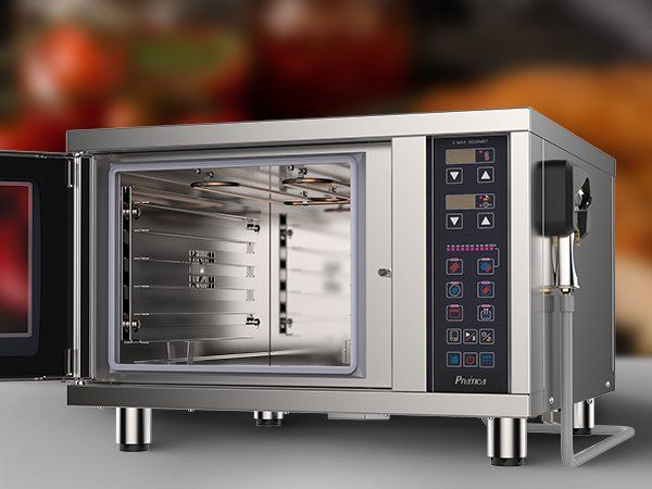 Un horno microondas de acero inoxidable con la puerta abierta.