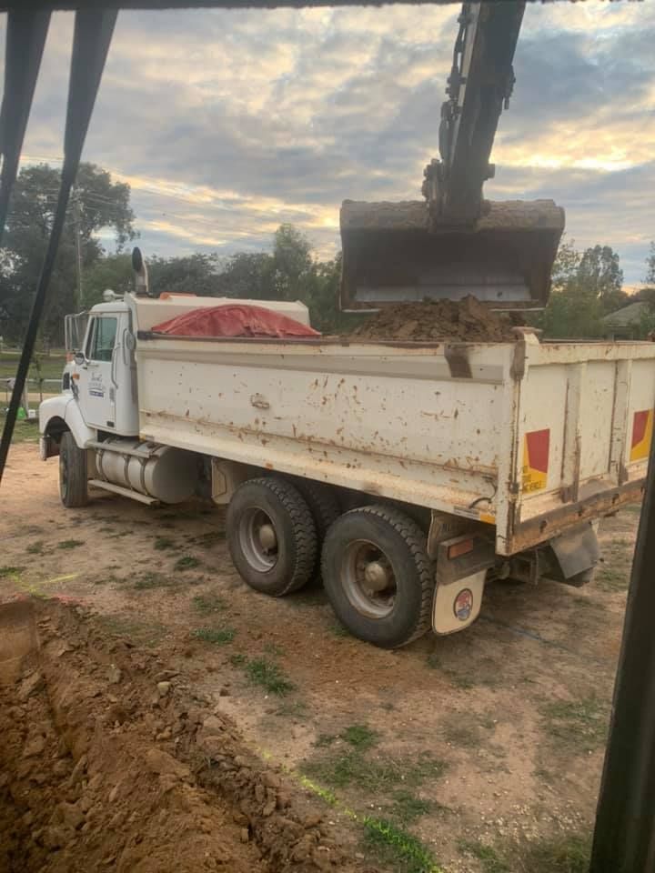 An Excavator Loads Soil into a White Truck | Benalla, Vic | Darrel's Diggers