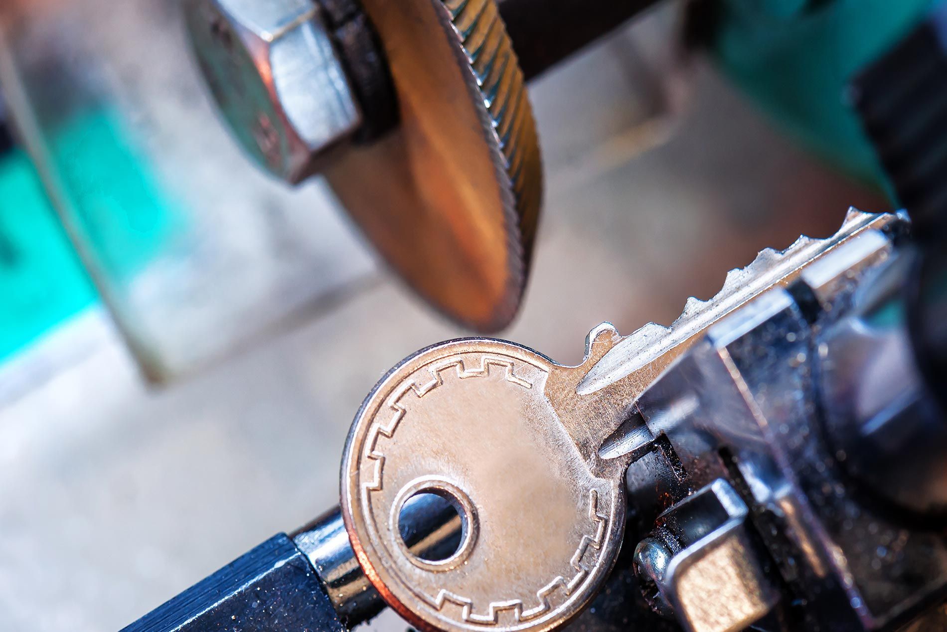 A Close up Of a Key Being Cut by A Machine.