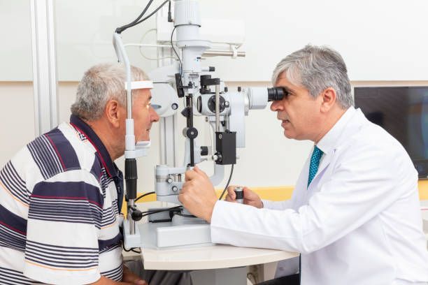 An Eye Doctor Performs an Examination on a Patient — Peninsula Eyecare Izzards Optometrists in Ettalong, NSW