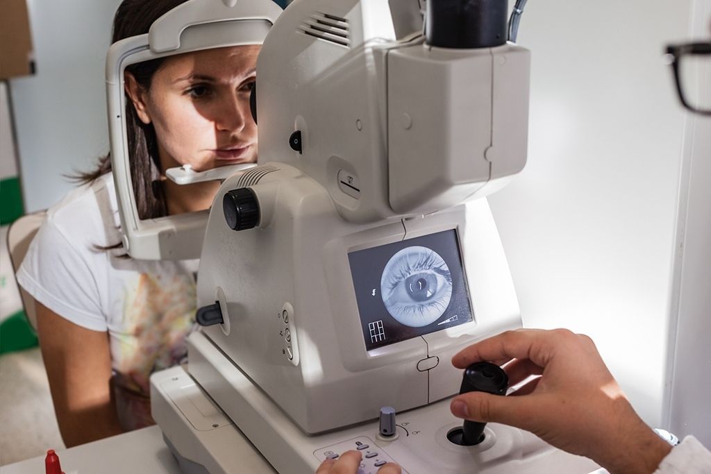 A Patient Having Their Eye Examined by a Practitioner — Peninsula Eyecare Izzards Optometrists in Ettalong, NSW