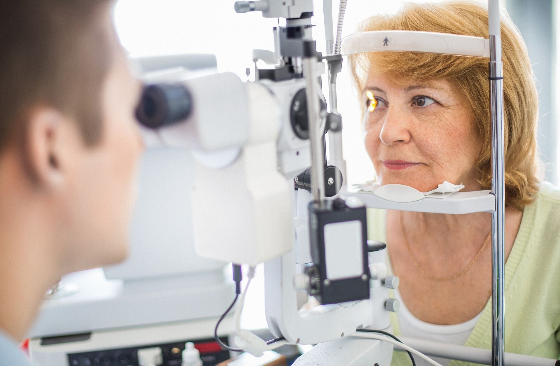 A Clinician Uses a Slit Lamp to Examine a Patient's Eye — Peninsula Eyecare Izzards Optometrists in Woy Woy, NSW