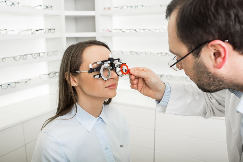 An Optometrist Using a Trial Frame to Test a Patient's Vision — Peninsula Eyecare Izzards Optometrists in Koolewong, NSW