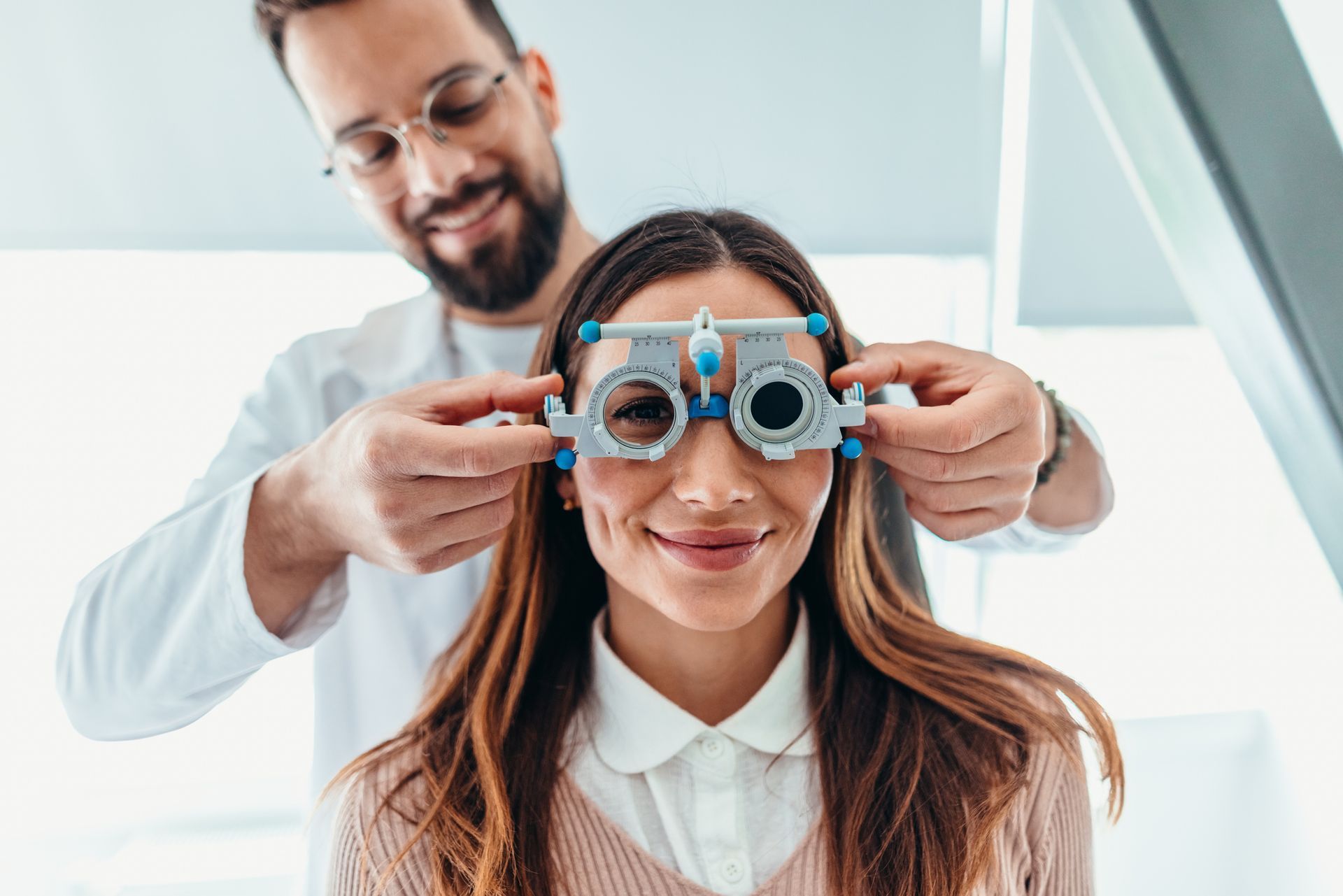Optometrist Adjusting Trial Glasses — Peninsula Eyecare Izzards Optometrists in Woy Woy, NSW