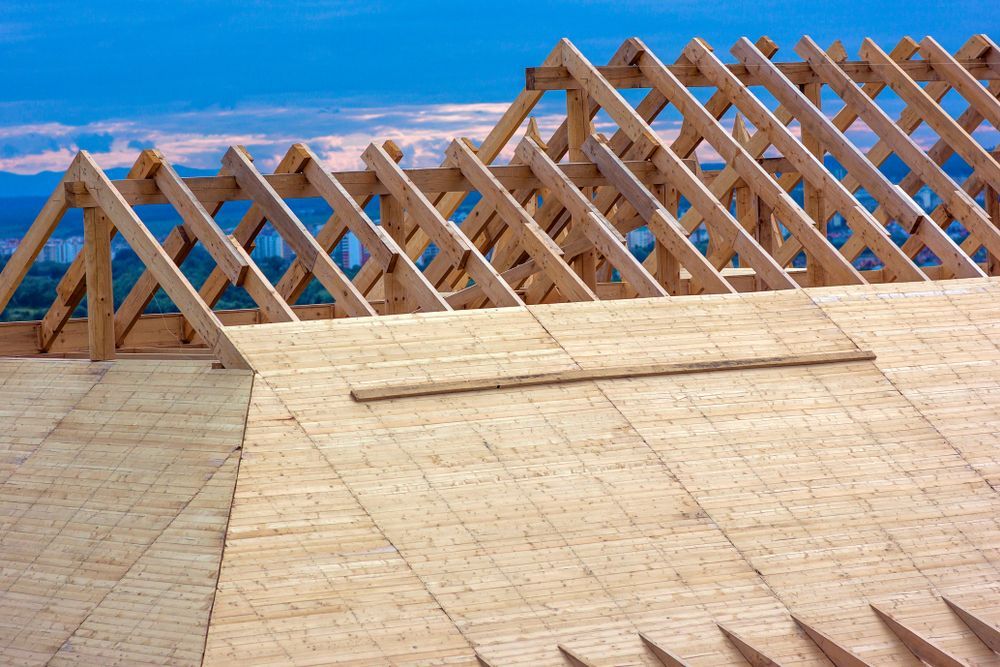 Wooden Roof Under Construction With Trusses and Plywood — Wilko Plate (Aust) Pty Ltd in Rockhampton, QLD