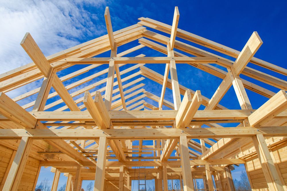 Wooden House Frame Under Construction, Against a Bright Blue Sky — Wilko Plate (Aust) Pty Ltd in Annandale, QLD