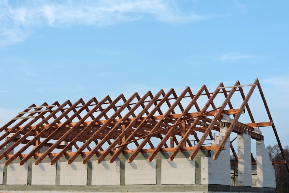 Roof Rafters Under Construction, Set Against a Light Blue Sky — Wilko Plate (Aust) Pty Ltd in Mackay, QLD