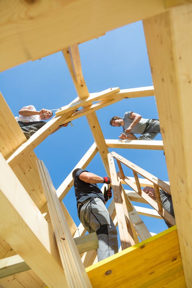 Construction Workers Assembling a Wooden Roof — Wilko Plate (Aust) Pty Ltd in Rockhampton, QLD
