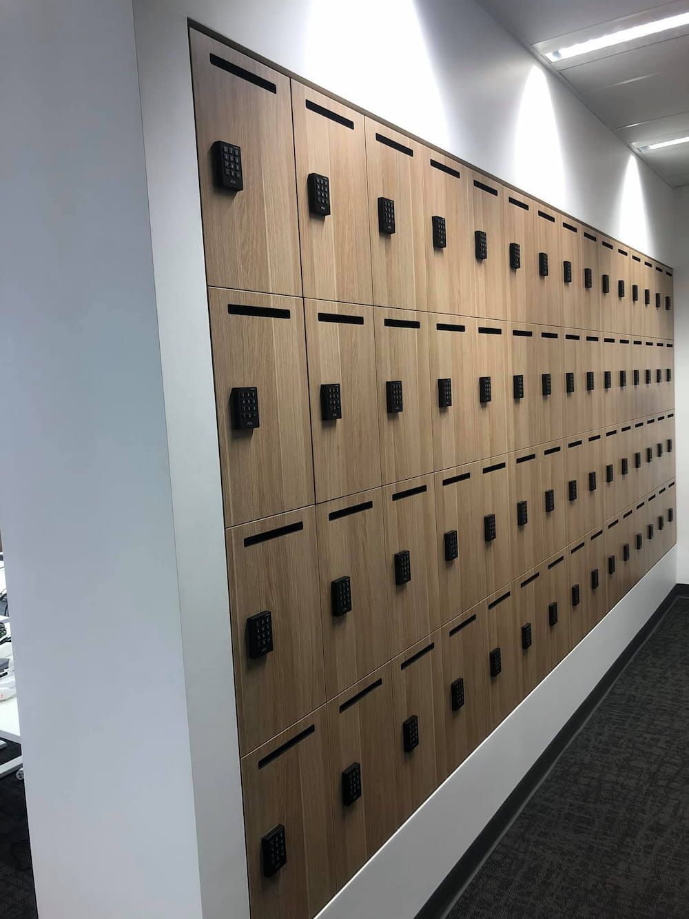A Wall of Wooden Lockers in a Hallway — Designer Kitchens in Berrimah, NT