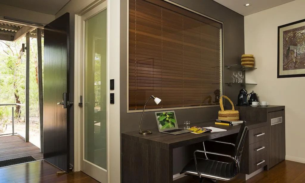 A Room With a Desk and Chair and a Laptop on It — Designer Kitchens in Berrimah, NT