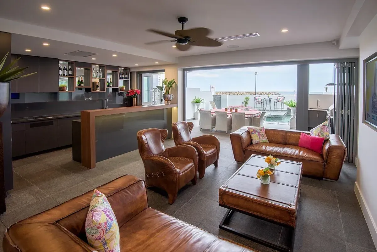 A Living Room Filled With Furniture and a Ceiling Fan — Designer Kitchens in Berrimah, NT