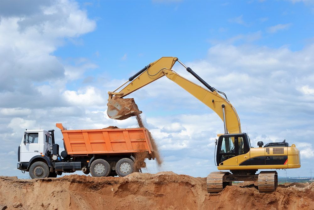 Excavator Loading Sand In Rear-End Tipper — Tipper Hire in Boomerang Beach, NSW