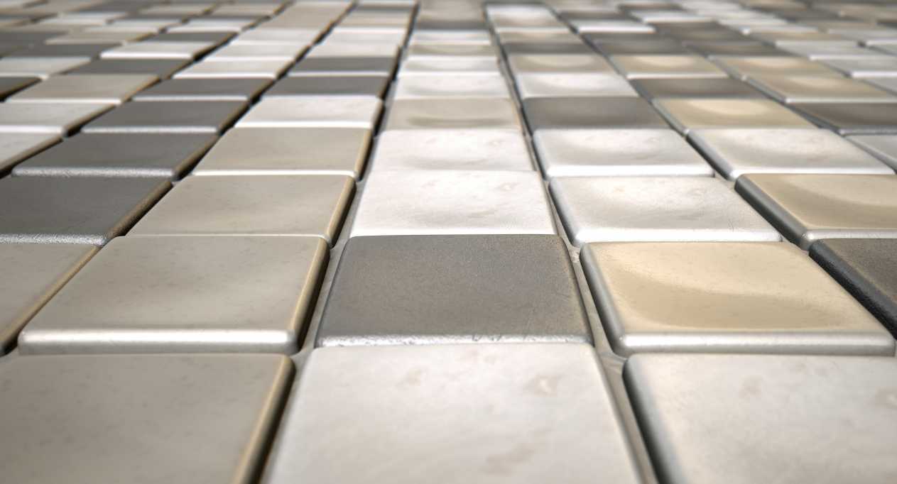 A close up of a gray and white tile floor