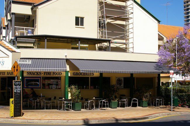 Building With a Sign That Says Snacks Fine Food — Blind Outfitters in Redlynch, QLD