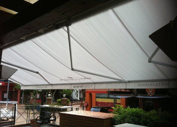 Large White Awning is Covering a Patio Area — Blind Outfitters in Atherton, QLD
