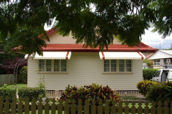 White House With a Red Roof and a White Awning — Blind Outfitters in Atherton, QLD