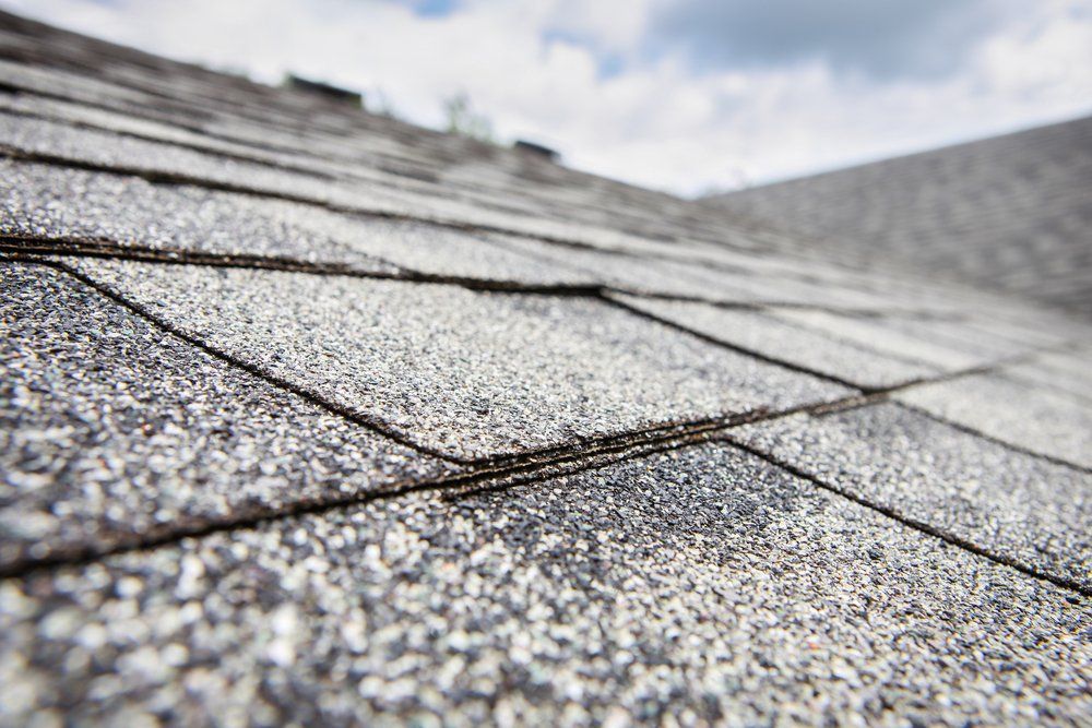 A close up of a roof with shingles on it.