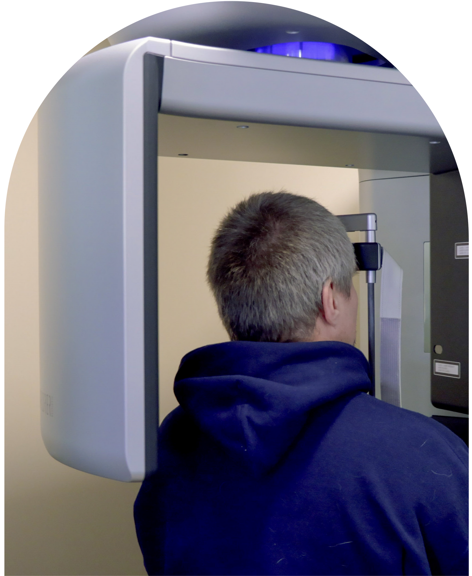 Patient having dental X-ray, dentist adjusting machine at at Vail Dental Associates in Hunt Valley, MD, 21030.