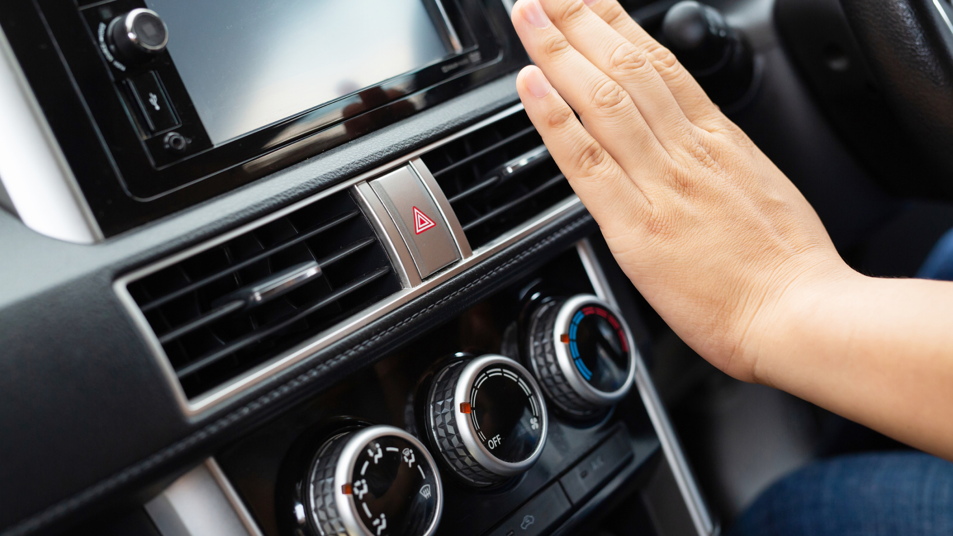 A Person Checking the Car's Climate | West Allis, WI | Southtown Tire & Auto A Person Checking the Car's Climate | West Allis, WI | Southtown Tire & Auto
