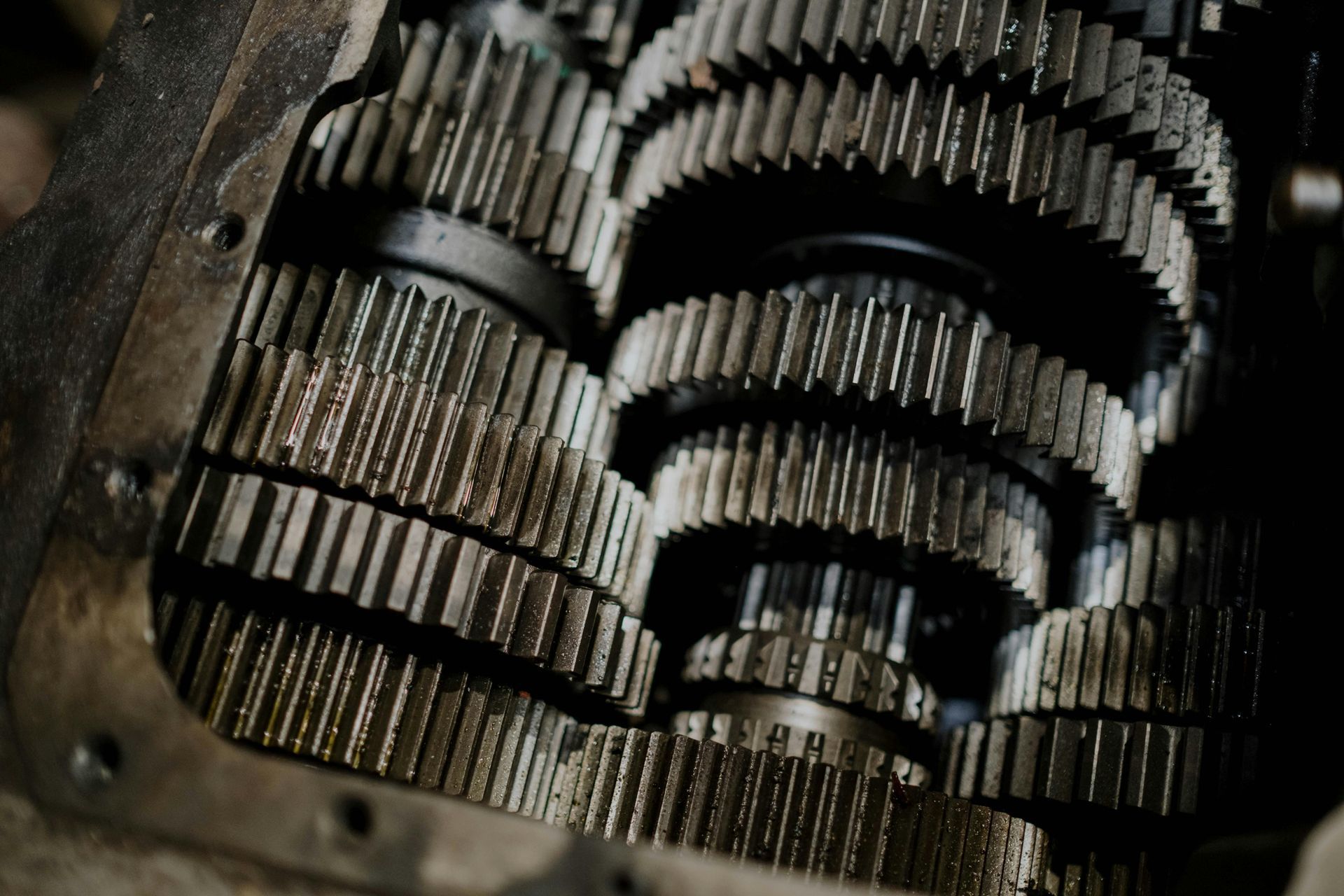 Close-up of interlocking metal gears inside a mechanical device, likely a transmission.