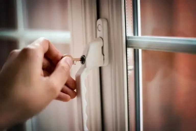A Person Is Opening a Window with A Key — The Lock Doctor in Mount Hutton, NSW