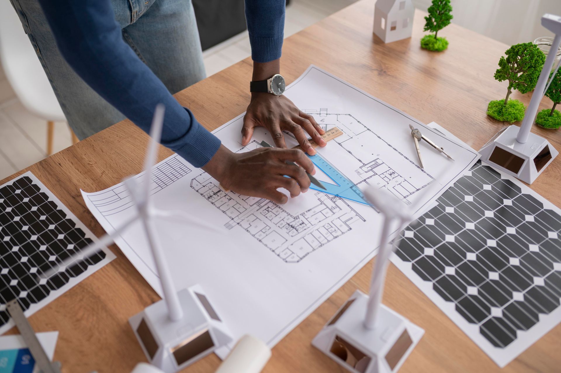 a man is working on a blueprint of a building