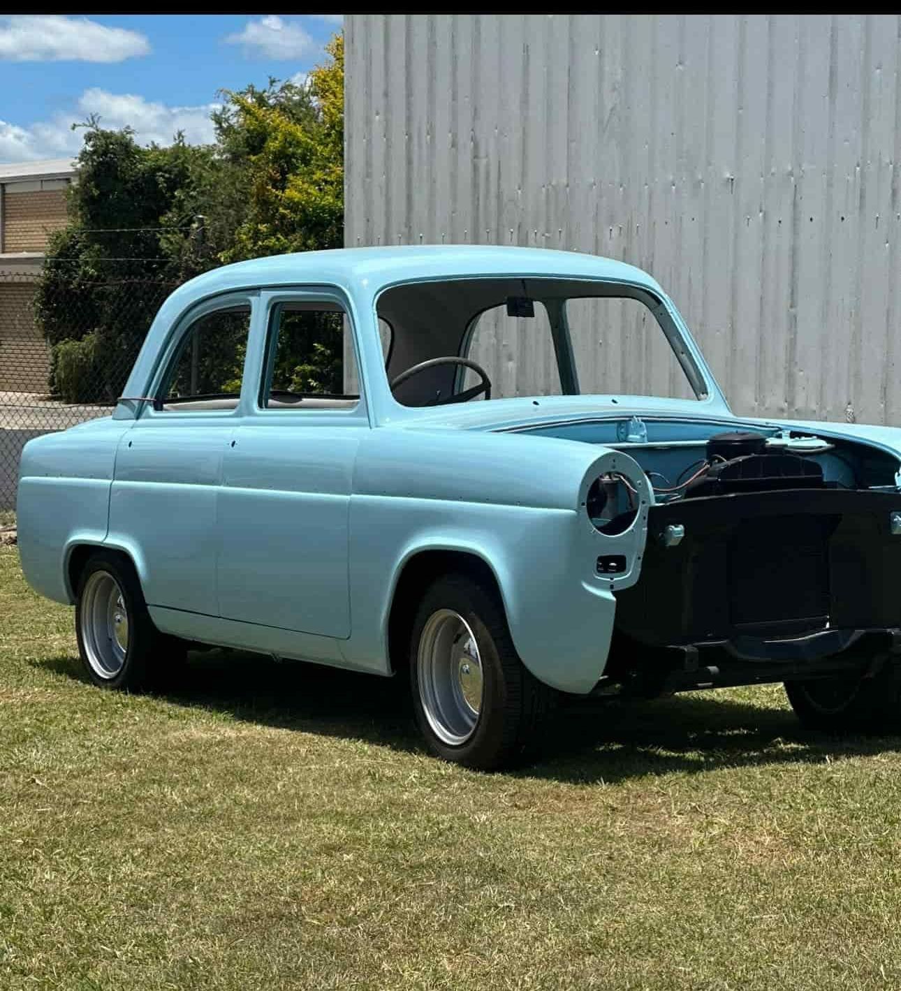 a baby Blue Car is Parked in a Grassy Field. — FSK Paint & Panel in Casino, NSW