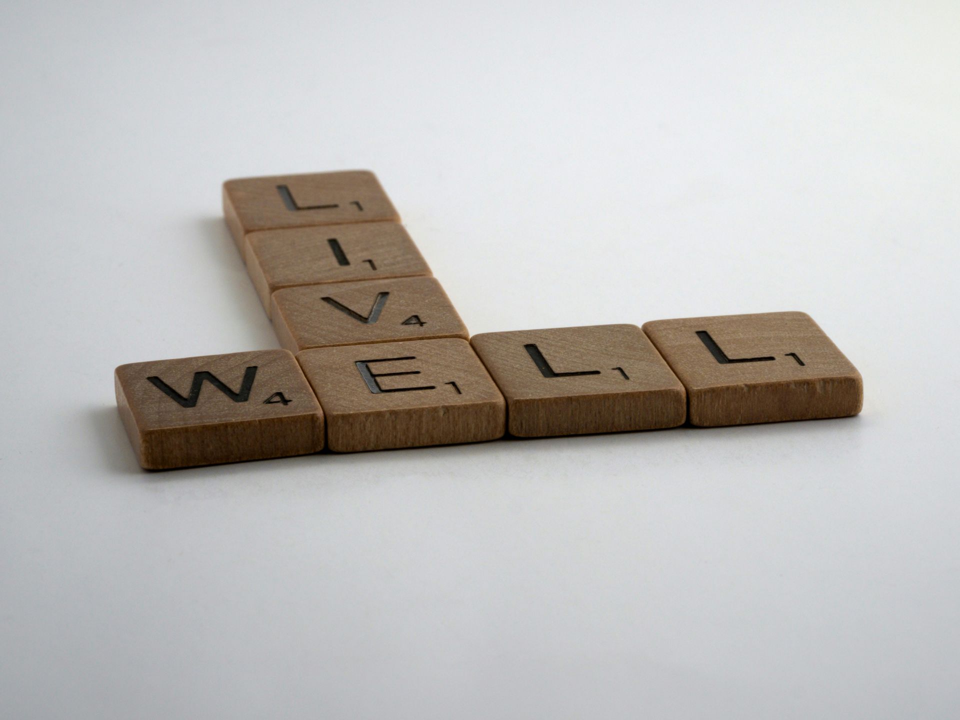 Wooden Scrabble tiles spelling 