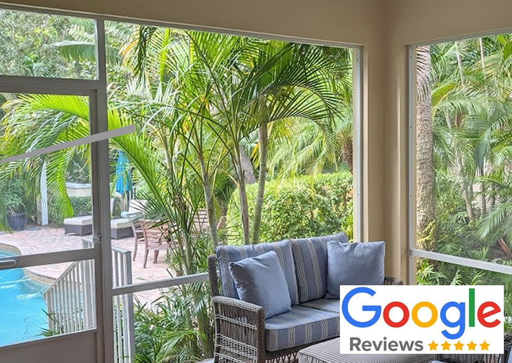A screened in porch with a swimming pool in the background