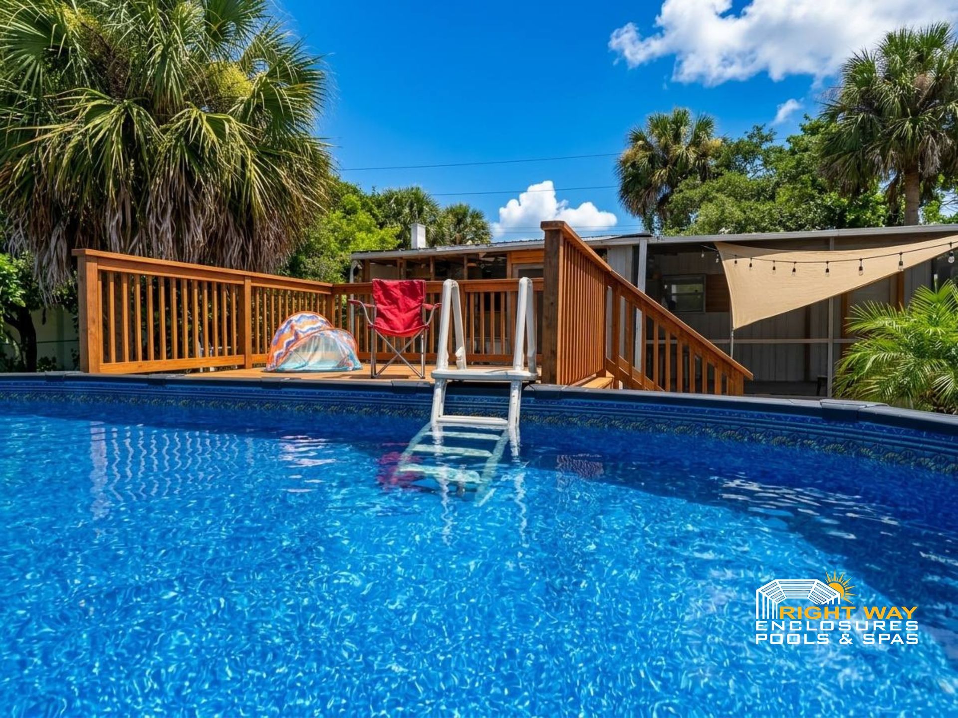 Round wood-grain resin above-ground pool with a wood deck in a Melbourne, Florida backyard on a clear summer day