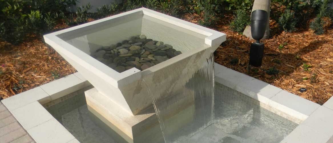 A large indoor swimming pool with a clear roof.