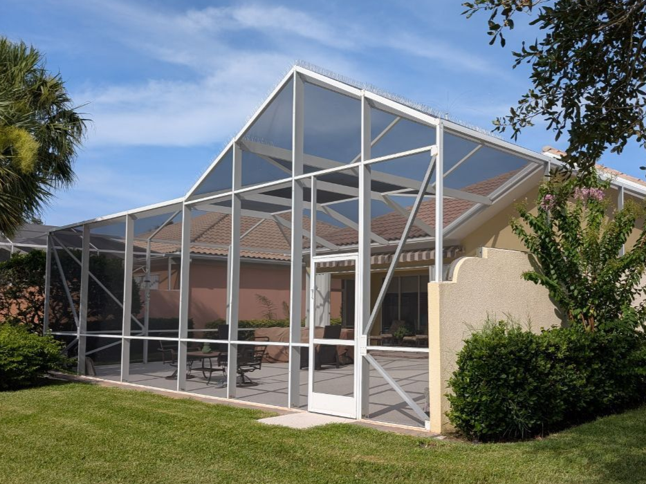 A large indoor swimming pool with a clear roof.