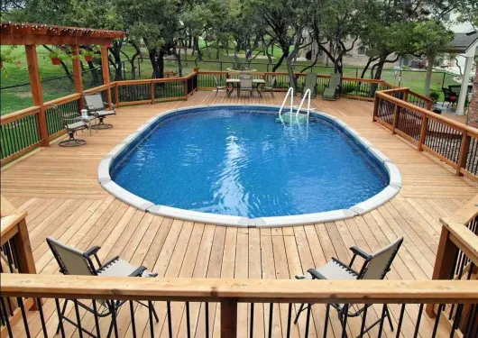 A large indoor swimming pool with a clear roof.
