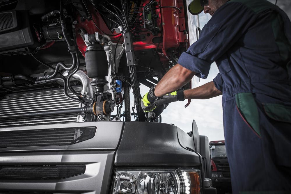 Mechanic Repairing A Truck — BITR Enterprises in Berkeley, NSW