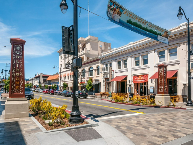 A city street with a lot of buildings and a street light.