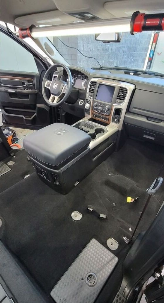 The interior of a dodge ram truck is being remodeled.