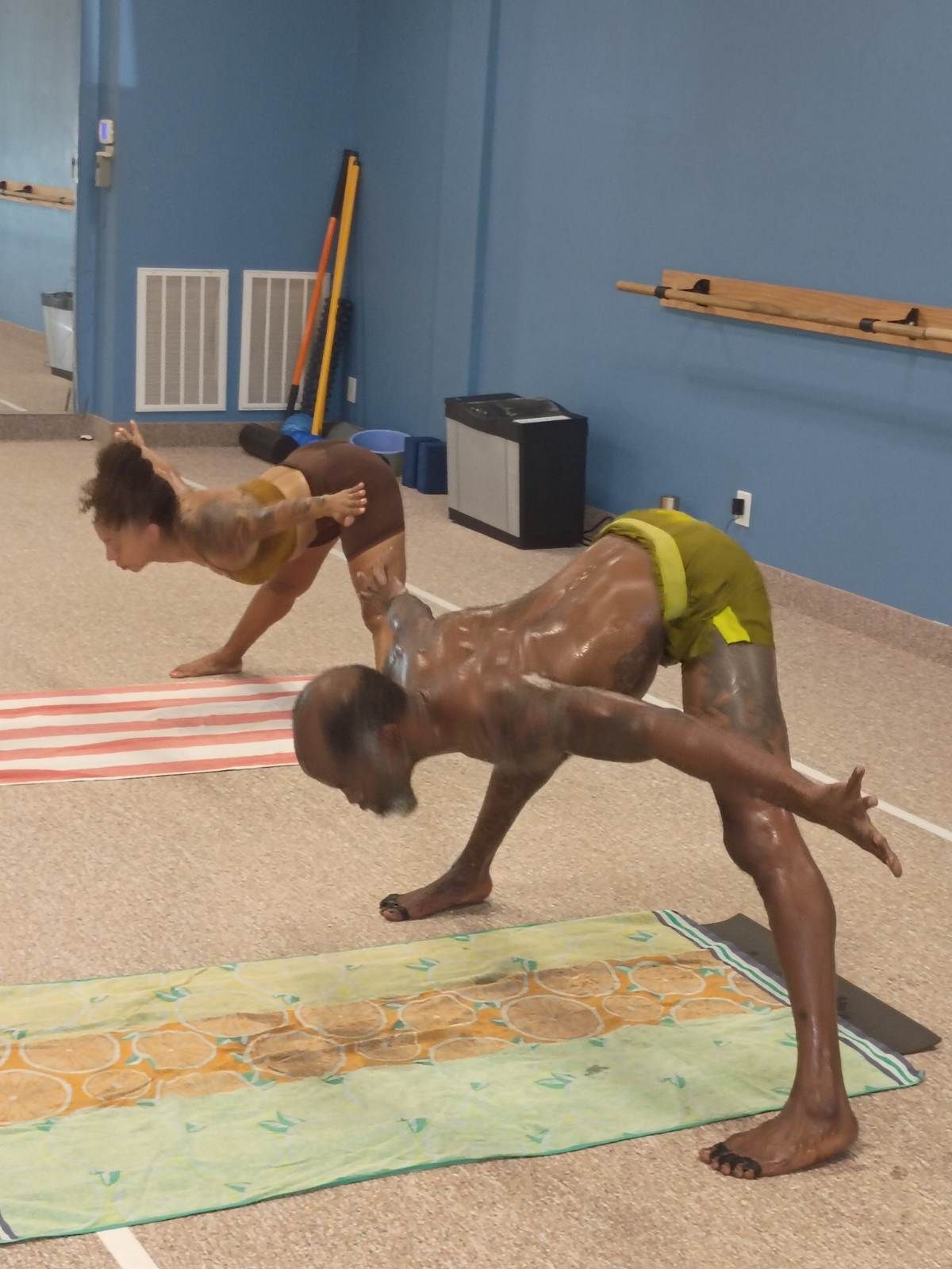 Students practicing the 26 & 2 hot yoga sequence at Pure Hot Yoga GR in Grand Rapids, MI