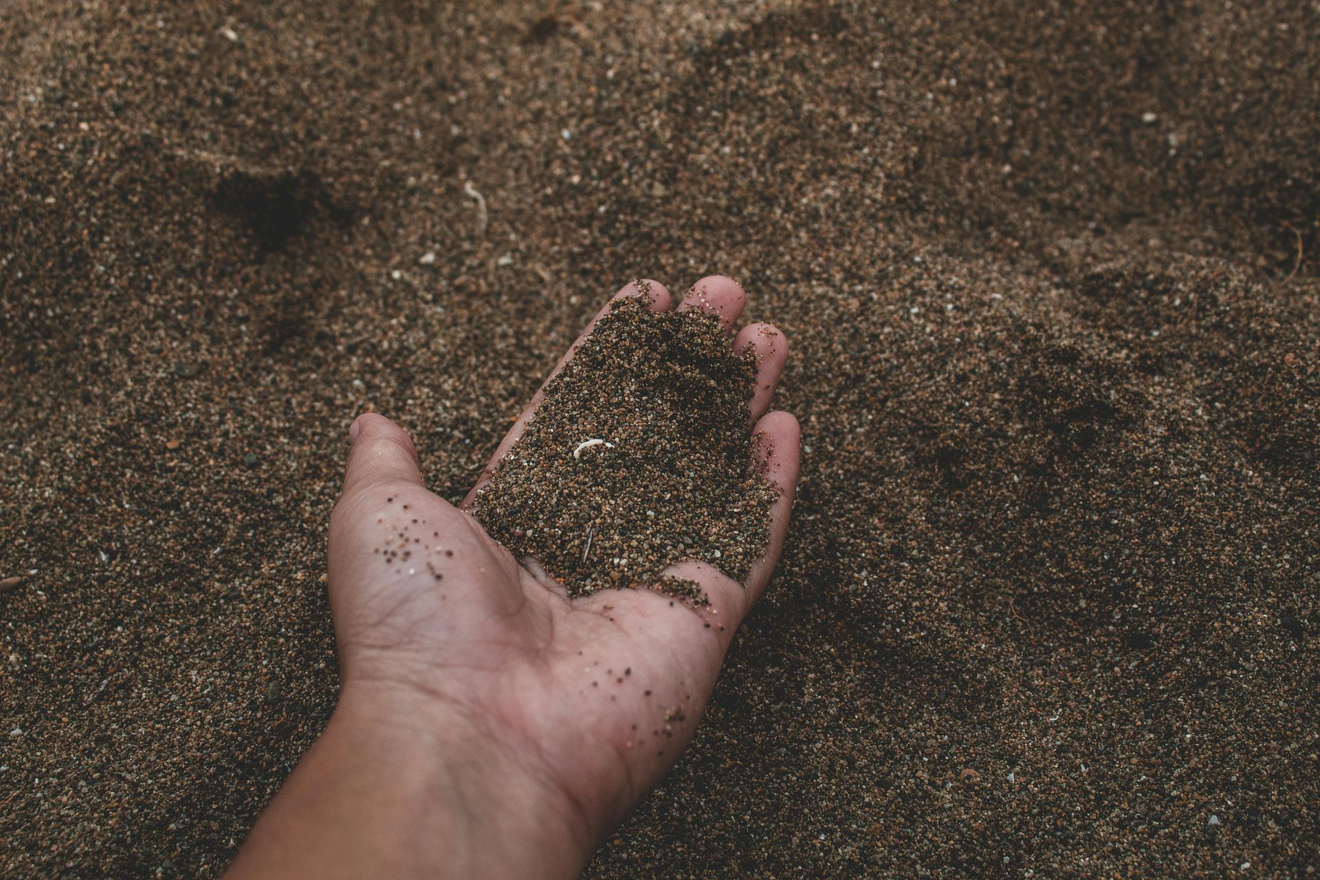 Hand in sand image