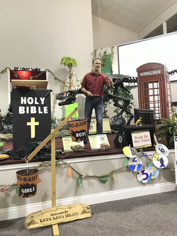 Ryan teaching VBS from stage