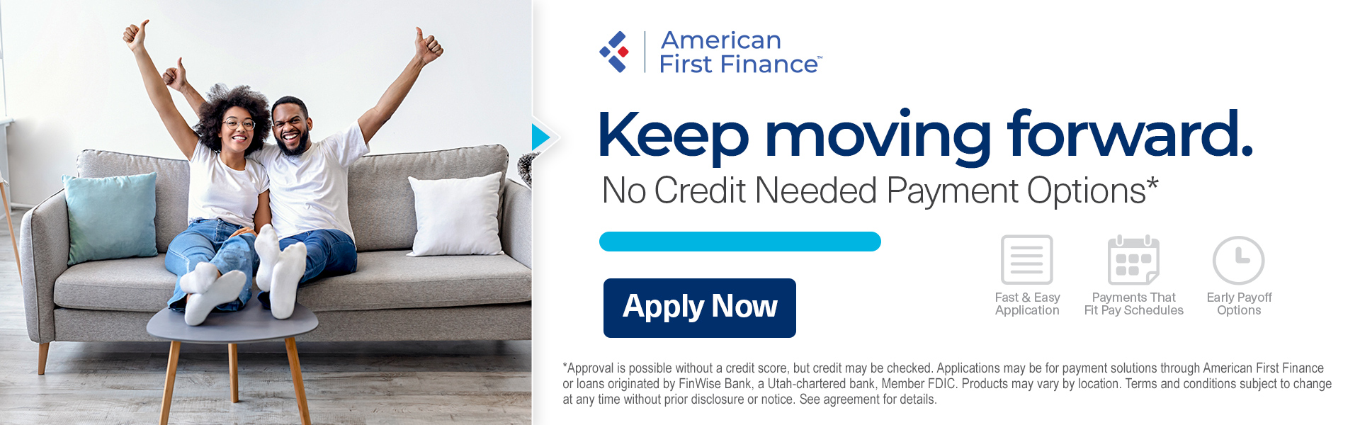 Couple celebrating on a couch, American First Finance ad. 