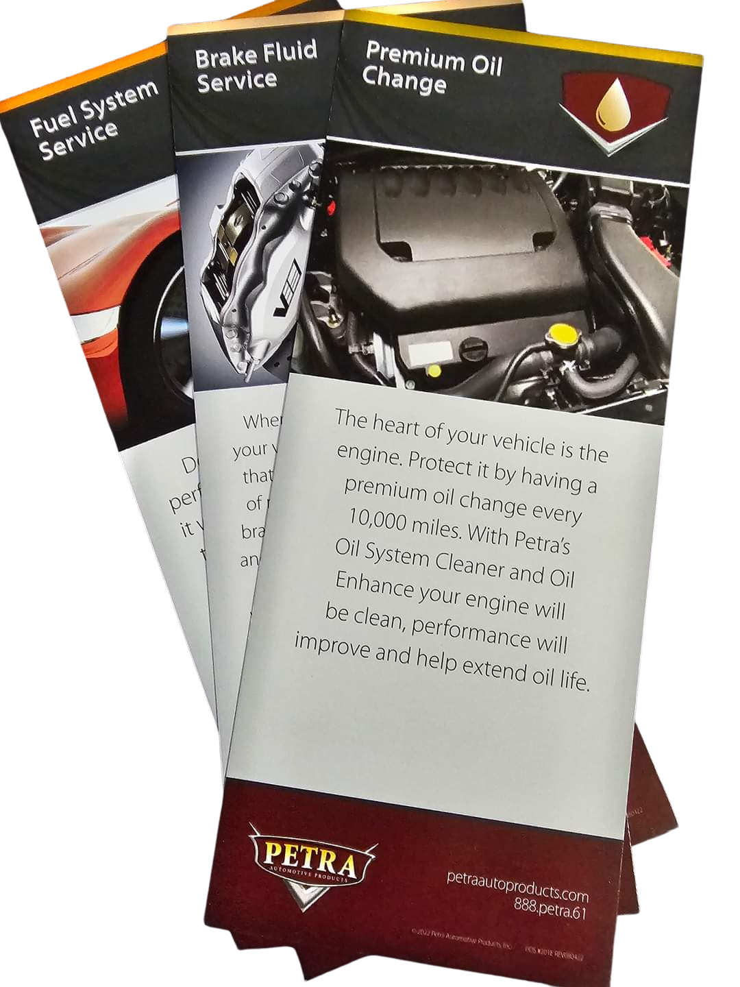 Three pamphlets are stacked on top of each other on a white background.
