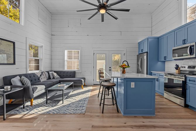 updated barn rental property with blue kitchen