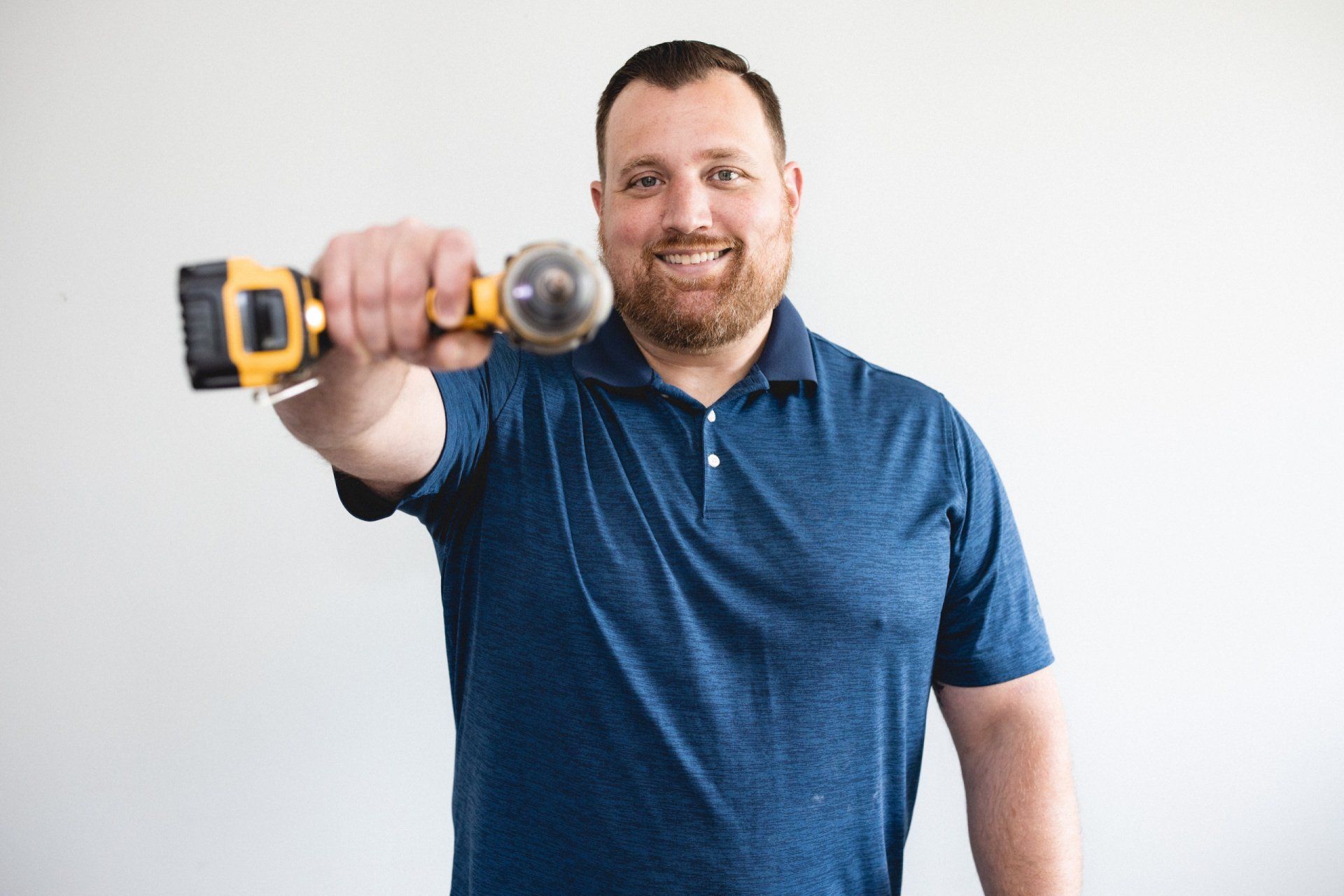 Drew holding a drill