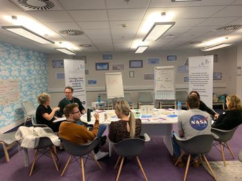 Suzy Beaumont Delivering stress management workshop with flip chart