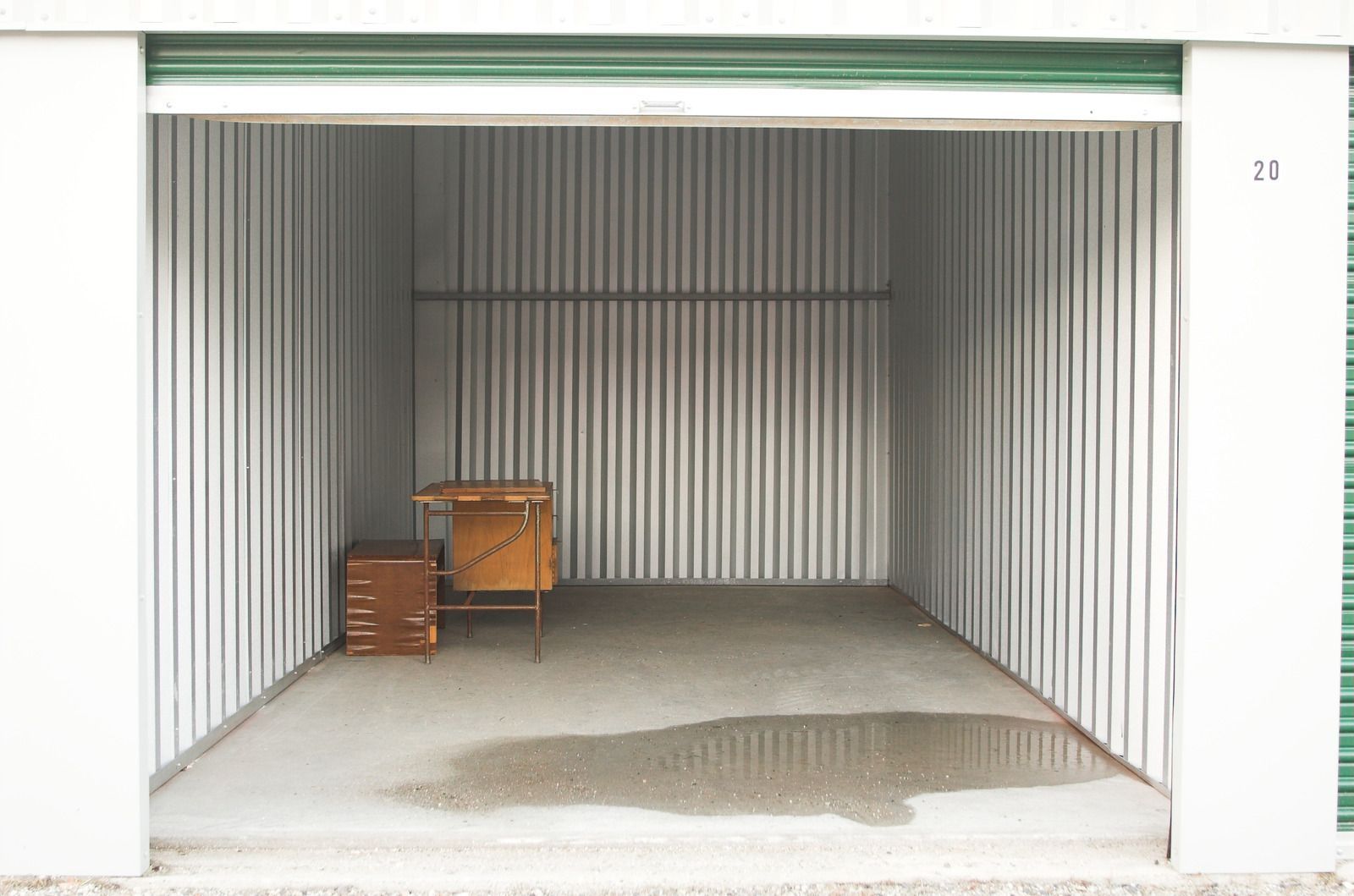 The inside of a moving truck filled with boxes and blankets.