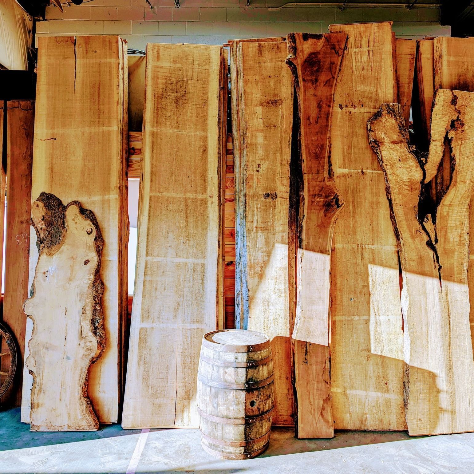Stacked wooden slabs leaning against a wall, custom millwork