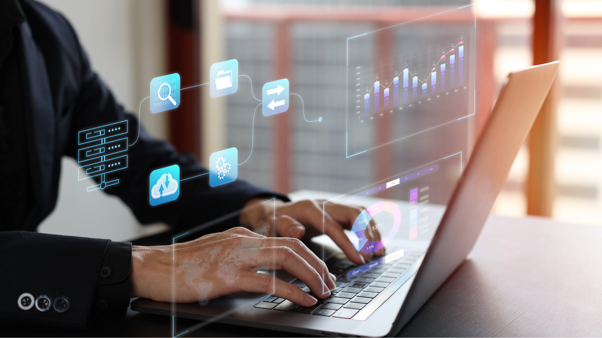 Hands typing on a laptop with floating blue digital icons and charts on a desk