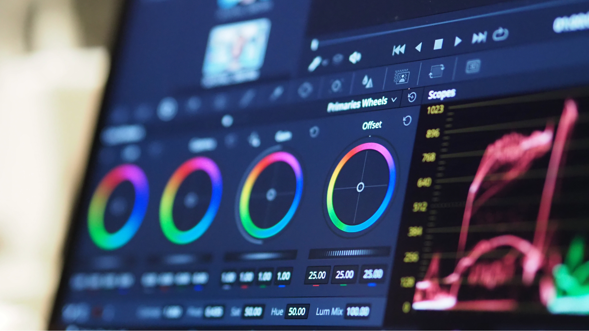 PGM video editor reviewing color-graded footage in a professional edit suite