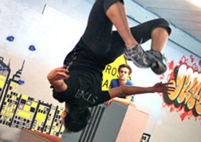 Person performing a backflip.