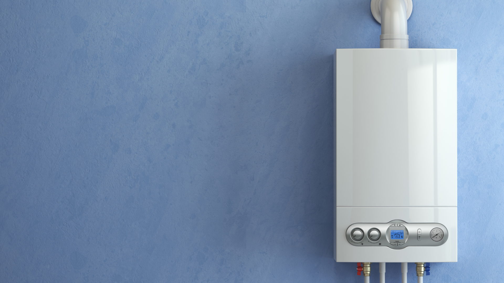 A white boiler is hanging on a blue wall.